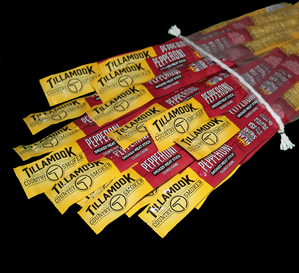 A bundle of Tillamook pepperoni meat sticks with red and yellow packaging.