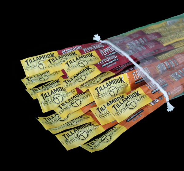 A bundle of Tillamook brand pepperoni and teriyaki flavored meat sticks tied together.