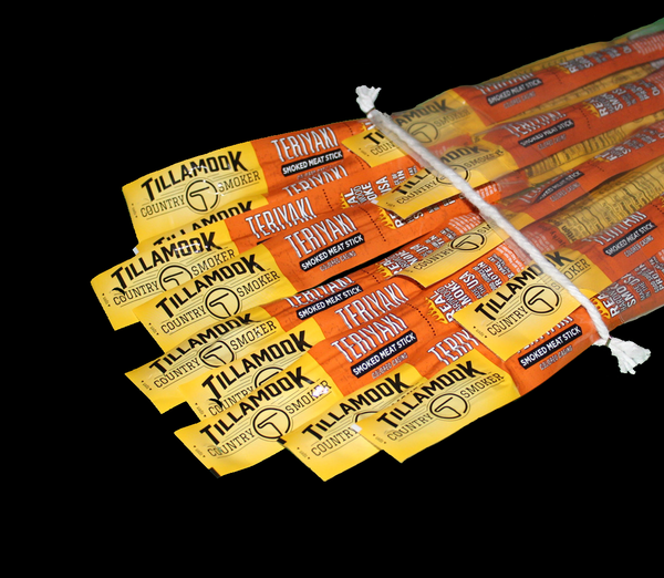 A bundle of Tillamook Teriyaki Meat Sticks tied together with an orange and black label.